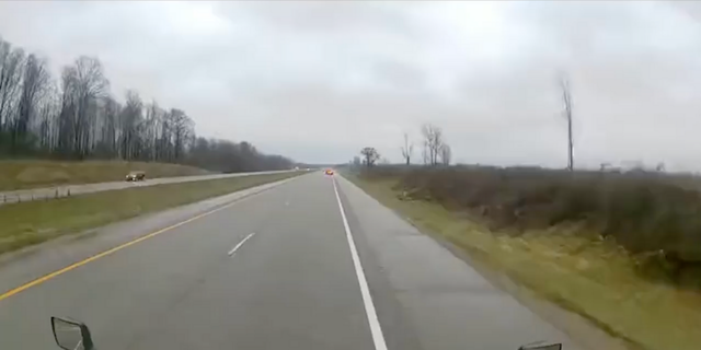 Police said the semi-truck was on I-94 in Paw Paw, Michigan when it hit the Michigan State Police trooper's car from behind while its emergency lights were on, according to Fox 2 Detroit.