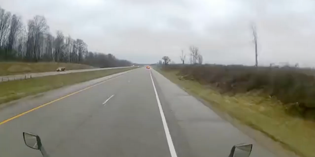 Police said the semi-truck was on I-94 in Paw Paw, Michigan when it hit the Michigan State Police trooper's car from behind while its emergency lights were on, according to Fox 2 Detroit.