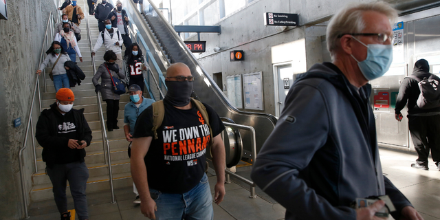 Riders depart the BART station in Antioch, Calif., on Monday, March 22, 2021.