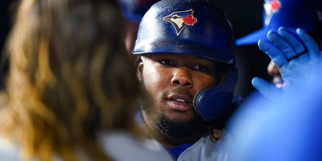 Toronto Blue Jays' Vladimir Guerrero Jr. is congratulated after hitting a two-run home run during the third inning of the team's baseball game against the New York Yankees on Wednesday, aprile 13, 2022, in New York.