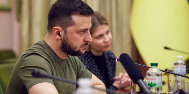 Ukrainian President Volodymyr Zelenskyy listens during his meeting with President of the European Parliament Roberta Metsola in Kyiv, Ukraine, Friday, April 1, 2022.