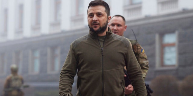 In this photo provided by the Ukrainian Presidential Press Office, Ukrainian President Volodymyr Zelenskyy, center, walks before a meeting with President of the European Parliament Roberta Metsola in Kyiv, Ukraine, Friday, April 1, 2022. 