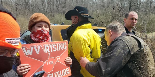 Climate activists protest Joe Manchin at a power plant in West Virginia.