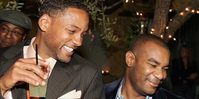 Will Smith with James Lassiter at an after-party following the Warner Bros. premiere of "ATL" March 30, 2006, in Hollywood.