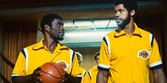 This image released by HBO shows Quincy Isaiah, portraying Magic Johnson, left, and Solomon Hughes, portraying Kareem Abdul-Jabbar, in a scene from the series 