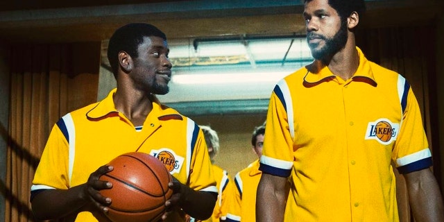 This image released by HBO shows Quincy Isaiah, portraying Magic Johnson, left, and Solomon Hughes, portraying Kareem Abdul-Jabbar, in a scene from the series