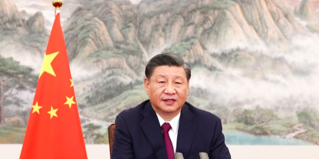 In this photo released by China's Xinhua News Agency, Chinese president Xi Jinping delivers a speech via video link to the opening ceremony of the Bo'ao Forum For Asia in Bo'ao in southern China's Hainan Province, Thursday, April 21, 2022. Xi said his government supports talks to resolve international disputes, but opposes the use of sanctions. 