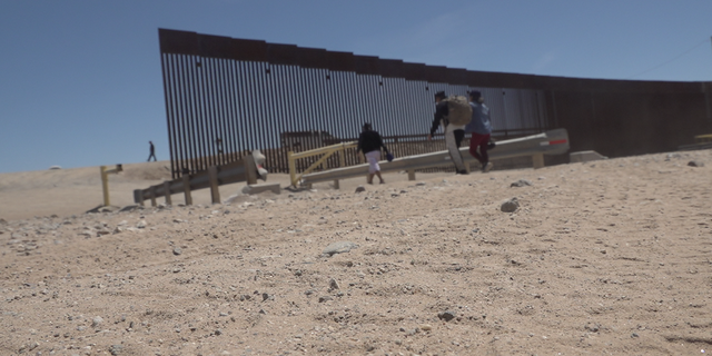 Migrants trying to cross the border into Yuma from Mexico.