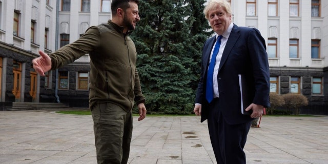 Ukrainian President Volodymyr Zelenskyy and U.K. Prime Minister Boris Johnson talk in Kyiv on Saturday, March 9, 2022.