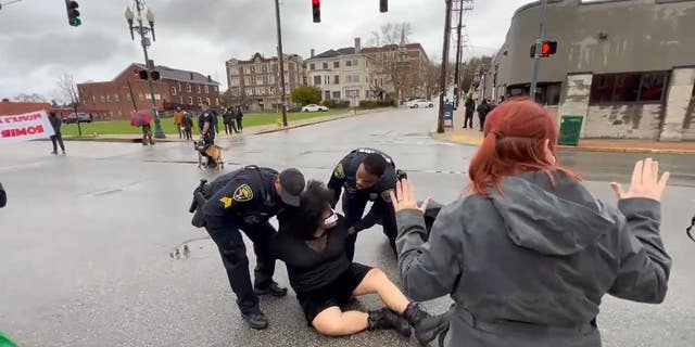 Wilkinsburg police officers arrest an activist at a Black Lives Matter protest. (courtesty, Twitter: @WickPhoto)