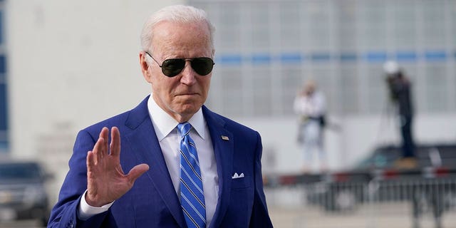 President Joe Biden waves boarding Air Force One in Des Moines Iowa, Tuesday, April 12, 2022.