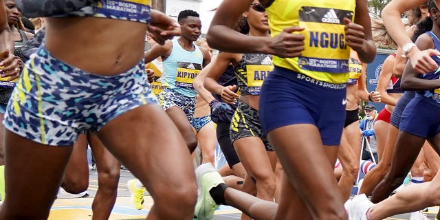 Diana Kipyogei of Kenya, center, at the start of the 125th Boston Marathon on Oct. 11, 2021, in Hopkinton, Massachusetts.