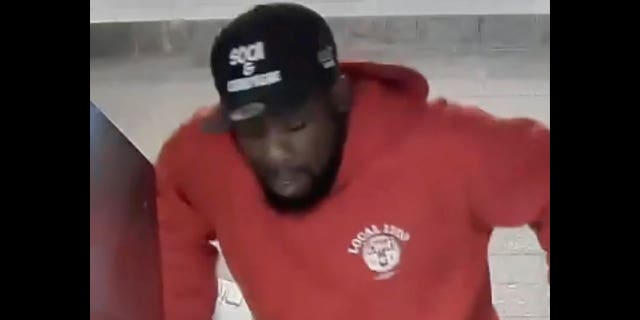 The suspect jumps a turnstile at Whitehall Street-South Ferry station shortly after the attack. (@NYPDnews)