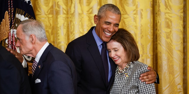 WASHINGTON, DC - APRIL 5: Former President Barack Obama hugs Speaker of the House Nancy Pelosi (D-CA) at the end of an event to mark the 2010 passage of the Affordable Care Act in the East Room of the White House on April 5, 2022 in Washington, DC. With then-Vice President Joe Biden by his side, Obama signed 'Obamacare' into law on March 23, 2010. (Photo by Chip Somodevilla/Getty Images)