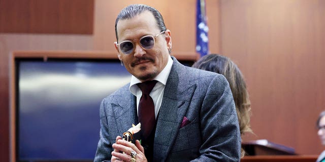 Actor Johnny Depp arrives in the courtroom at the Fairfax County Circuit Court in Fairfax, Va., Thursday, April 28, 2022. 