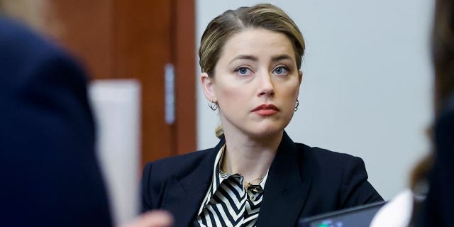 Amber Heard appears in the courtroom at the Fairfax County Circuit Court in Fairfax, Va., on Wednesday, April 27, 2022.