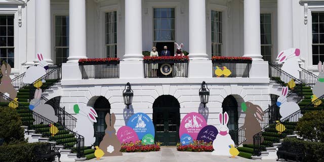 President Joe Biden appears with first lady Jill Biden and the Easter Bunny on the Blue Room balcony at the White House on April 5, 2021, in Washington. The White House Easter Egg Roll is returning on April 18, 2022, after a 2-year, COVID-induced hiatus. 