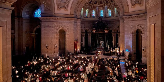 Easter Vigil Mass typically begins in a darkened, candlelit room that is illuminated once the gospel begins, proclaiming the resurrection of Jesus Christ.