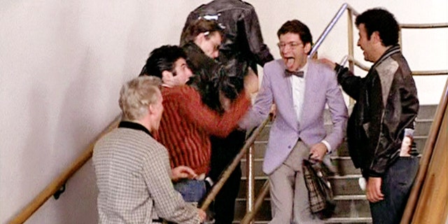 Seen here, the T-Birds in "Grease" prank on Eugene (wearing glasses and bow tie), played by Eddie Deezen.