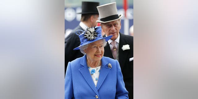 Britain's Queen Elizabeth II and Prince Philip arrive for the Epsom Derby at to mark the 60th anniversary of the Queen's accession to the throne Saturday, June 2, 2012. 