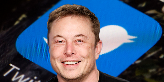 SpaceX founder Elon Musk smiles at a press conference following the first launch of a SpaceX Falcon Heavy, U.S., February 6, 2018. REUTERS/Joe Skipper and file photo of the Twitter app icon . (AP Photo/Matt Rourke, File)
