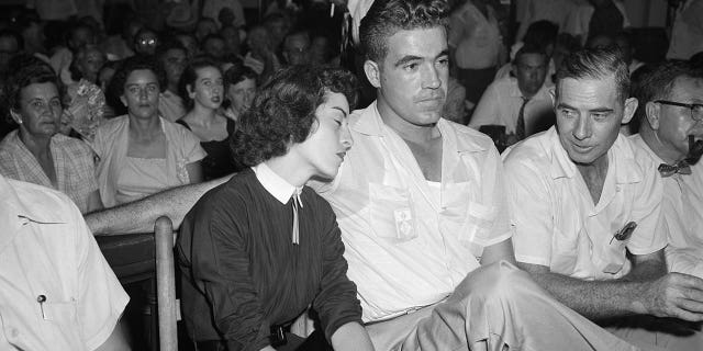 Carolyn Bryant rests her head on her husband Roy Bryant's shoulder after she testified in the Emmett Till murder case in Sumner, Mississippi, on Sept. 22, 1955.