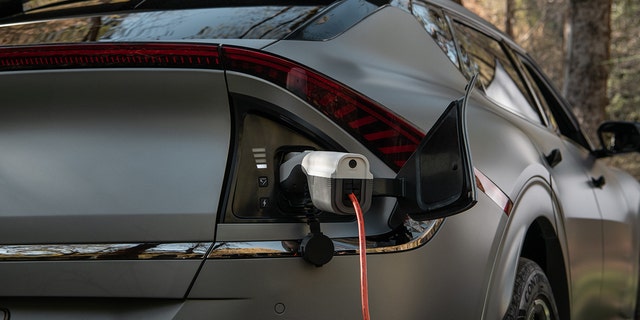 An adapter turns the EV6 charge port into a 110-volt outlet with 1,900 kilowatts of power.