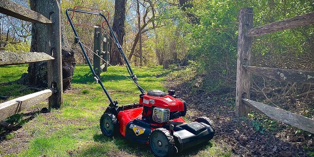 A Craftsman mower sits on a grassy path at Hoyt Farm Town Park in Commack, N.Y., on April 29, 2022. (Jeff Gumin)