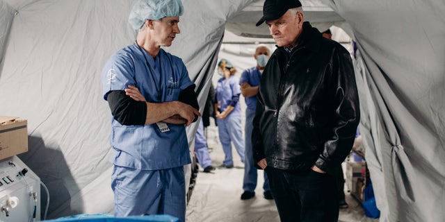 Franklin Graham (at right) is shown in April 2022 in one of the medical clinics his organization set up in Ukraine amid the Russia-Ukraine war. 