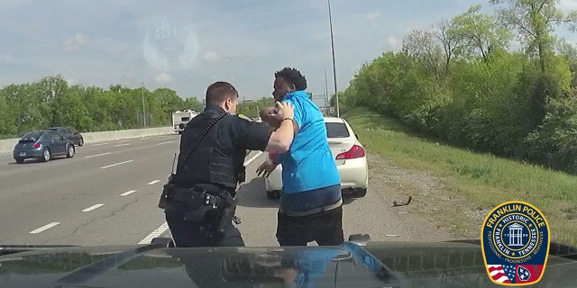 Roy Nicholson began resisting Officer Dustyn Stevens during a traffic stop on Sunday, authorities said. Stevens had asked Nicholson to step out of his vehicle after spotting a gun and smelling marijuana inside the car, according to police.