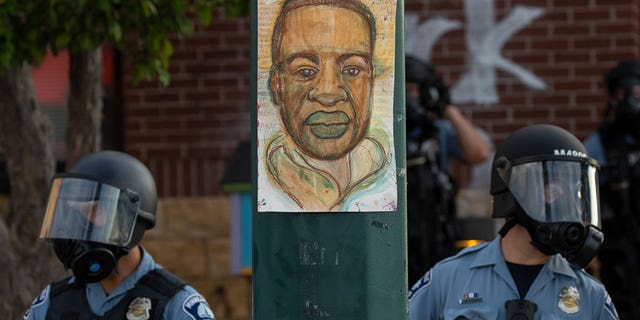 Minneapolis police stand outside the department's 3rd Precinct on May 27, 2020, in Minneapolis. 