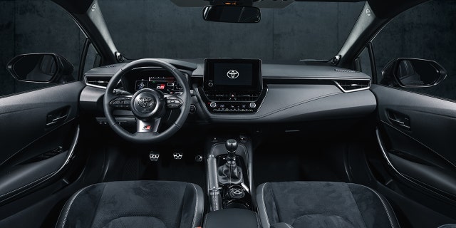 Sports seats and accents highlight the GR Corolla's interior.