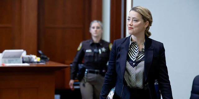 Heard arrives for her ex-husband Depp's defamation trial against her.