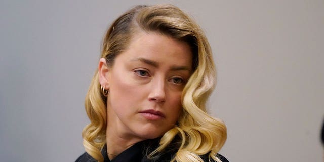 Actress Amber Heard listens in court April 18, 2022. 
