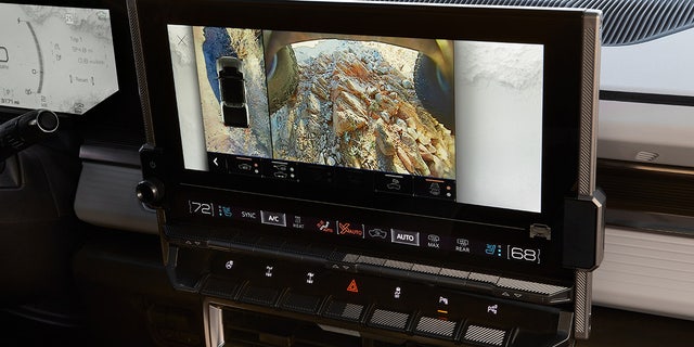 A 360-degree camera system includes views under the vehicle and a washing mechanism for the underbody cameras.