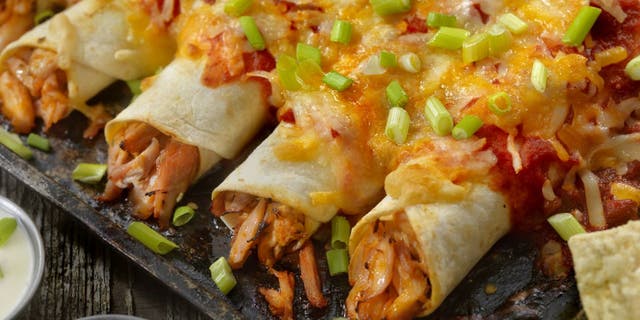 Enchiladas are typically made with meat, cheese, salsa and onions.