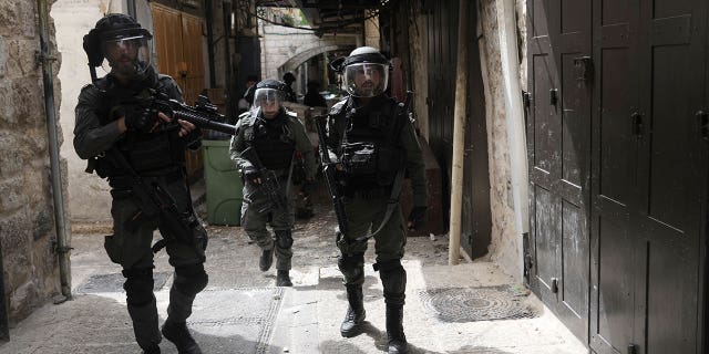 Israeli police is deployed in the Old City of Jerusalem, Sunday, April 17, 2022. Israeli police clashed with Palestinians outside Al-Aqsa Mosque after police cleared Palestinians from the sprawling compound to facilitate the routine visit of Jews to the holy site and accused Palestinians of stockpiling stones in anticipation of violence. 