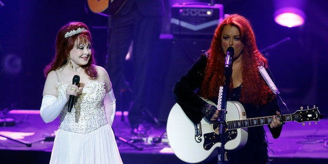 Recording artists Naomi Judd (L) and Wynonna Judd performing during the launch of their nine-show residency 