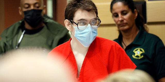 Nikolas Cruz enters the courtroom for a hearing at the Broward County Courthouse in Fort Lauderdale, Fla., on Wednesday, March 29, 2022. Cruz previously plead guilty to all 17 counts of premeditated murder and 17 counts of attempted murder in the 2018 shootings at Marjory Stoneman Douglas High School . (Amy Beth Bennett/South Florida Sun-Sentinel via AP, Pool)