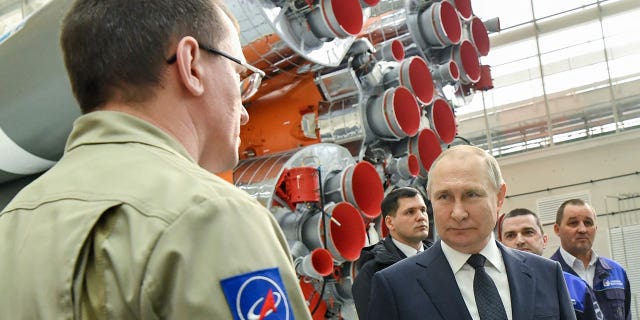 Russian President Vladimir Putin talks to employees of the Roscosmos space agency at a rocket assembly plant during his visit to the Vostochny Cosmodrome outside the town of Tsiolkovsky, about 200 kilometers (125 miles) of the city of Blagoveshchensk in the far eastern Amur Tsiolkovsky region, Russia, Tuesday, April 12, 2022. 