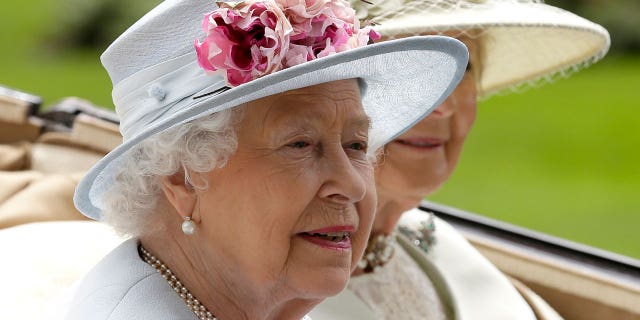 Britain's Queen Elizabeth II arrives at a parade ring with Princess Alexandra in a horse-drawn carriage in Ascot, England, June 20, 2018.  