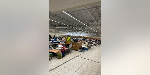 A room filled with cots is at a refugee center in Przemysl, Poland.