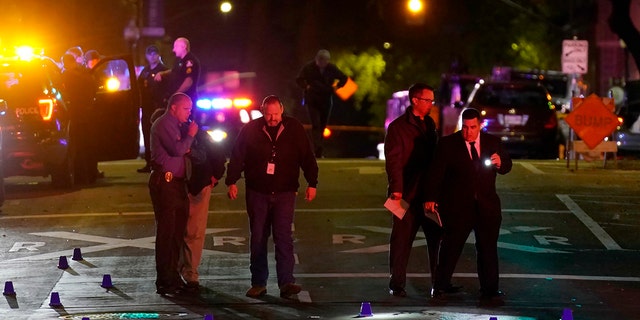 Authorities search the area of a mass shooting with multiple deaths in Sacramento, Calif., April 3, 2022.