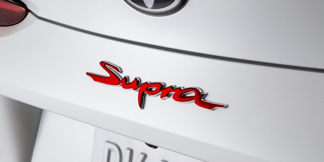 The A91-MT GR Supra features a unique red Supra badge.