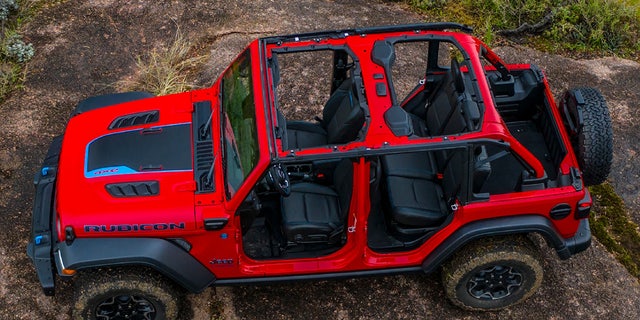 The Jeep Wrangler 4xe plug-in hybrid has an all-electric range of 21 miles per charge and a turbocharged four-cylinder engine for longer trips.