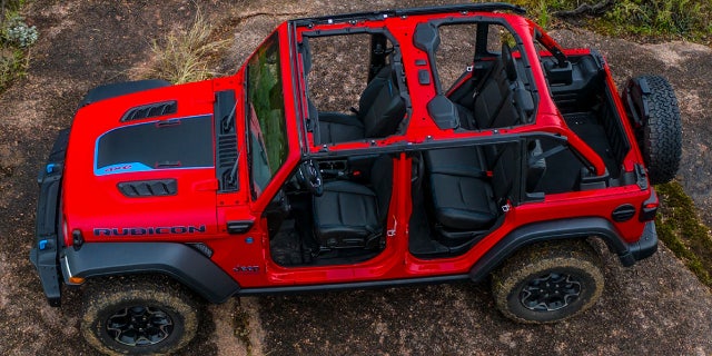 The Jeep Wrangler 4xe plug-in hybrid has an all-electric range of 21 miles per charge and a four-cylinder turbo engine for longer journeys.