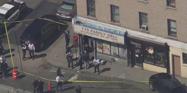 Authorities at the scene of a shooting in which a Yonkers, New York police officer was shot and a suspect was killed. A Yonkers police officer was shot Wednesday while trying to arrest three suspects during a joint investigation with the FBI. The suspect was killed when an FBI agent returned fire. 
