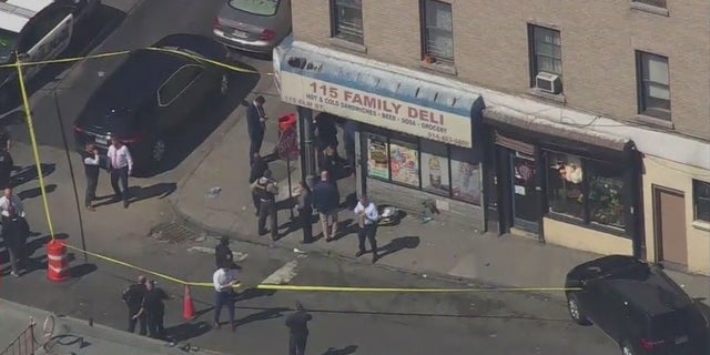Authorities at the scene of a shooting in which a Yonkers, New York police officer was shot and a suspect was killed. A Yonkers police officer was shot Wednesday while trying to arrest three suspects during a joint investigation with the FBI. The suspect was killed when an FBI agent returned fire.