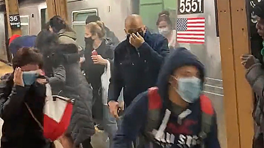 passengers running in New York subway