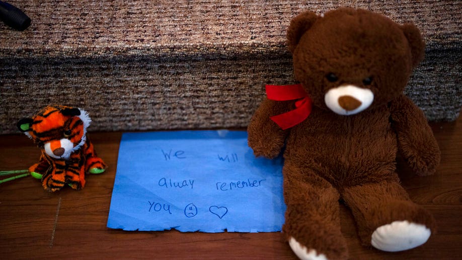 Stuffed animals are left at the altar during a prayer vigil for 10-year-old Iliana "Lily" Peters at Valley Vineyard Church in Chippewa Falls, Wis., Monday evening, April 25, 2022. Peters was found dead in a park earlier in the day after being reported missing the night before.